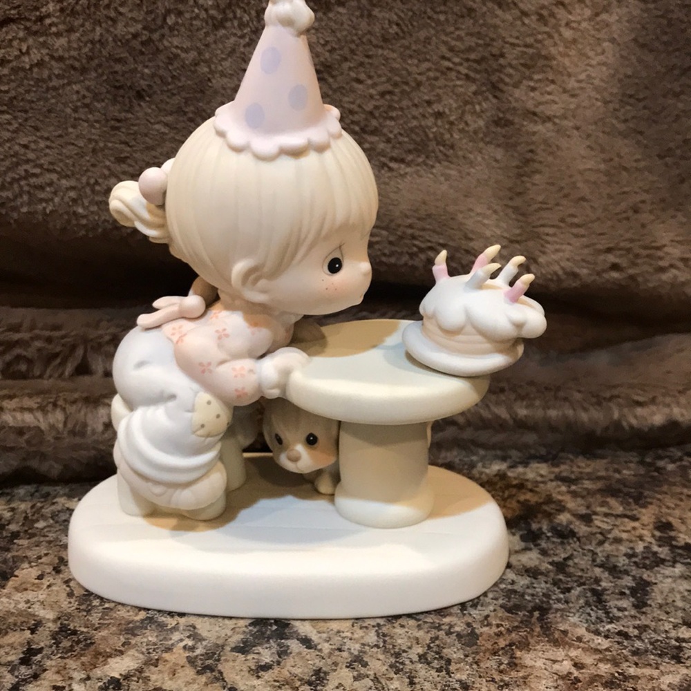 Precious moments birthday girl blowing out candle